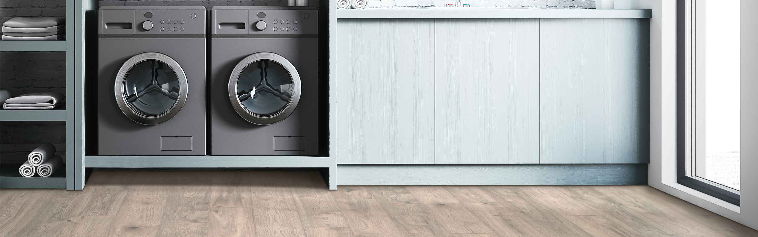 dark rustic laminate wood look flooring in laundry room with grey washing machine and dryer